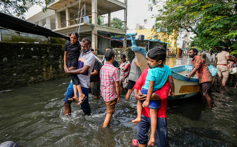 A community coming together to rebuild after the Chennai floods, symbolizing resilience, education, and empowerment.