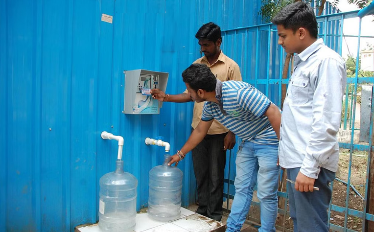 Image depicting a Water ATM providing clean water to a community, symbolizing accessibility and sustainability